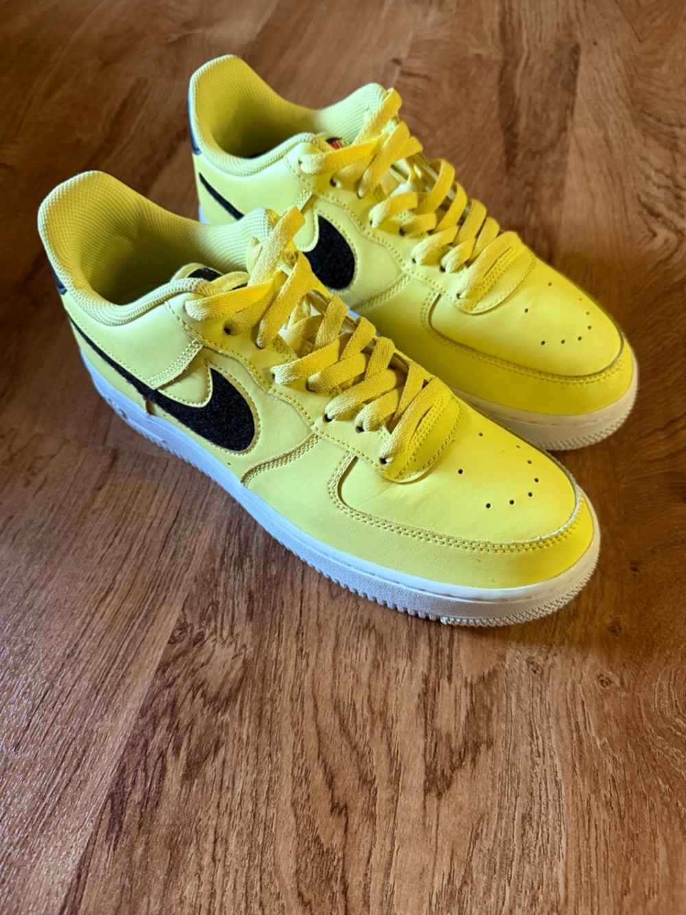 Nike Yellow Low-Top Sneakers with Black Swoosh